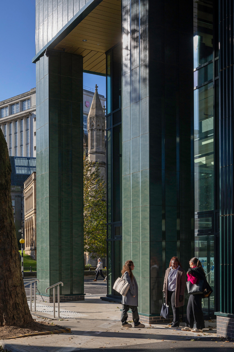 Design and Digital Arts – Nottingham Trent University – Hawkins Brown three people standing outside a green building
