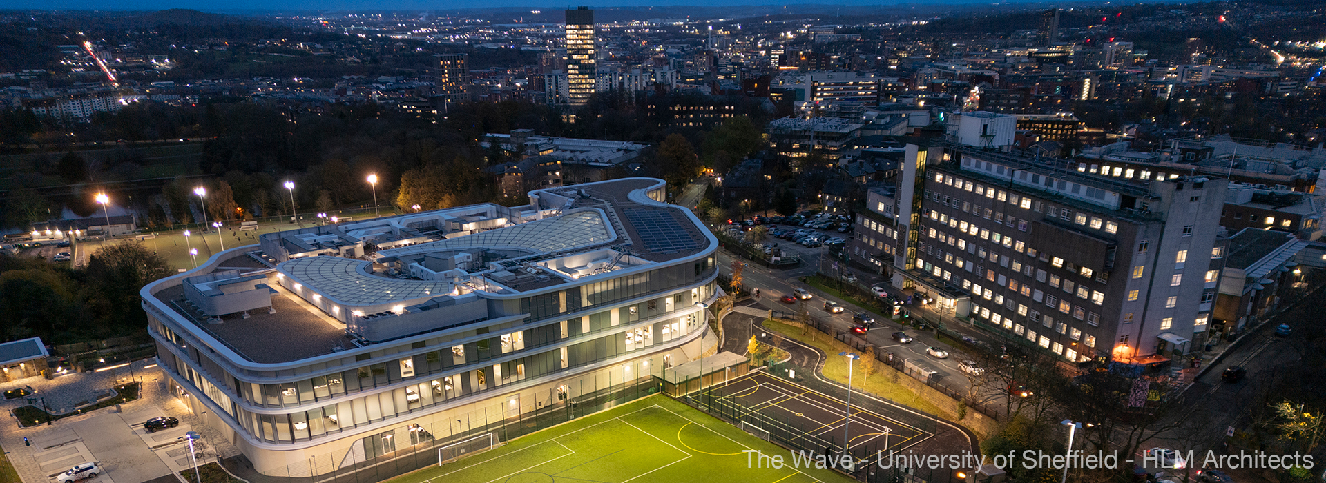 The Wave2-211123-055 aerial shot of building and city at night